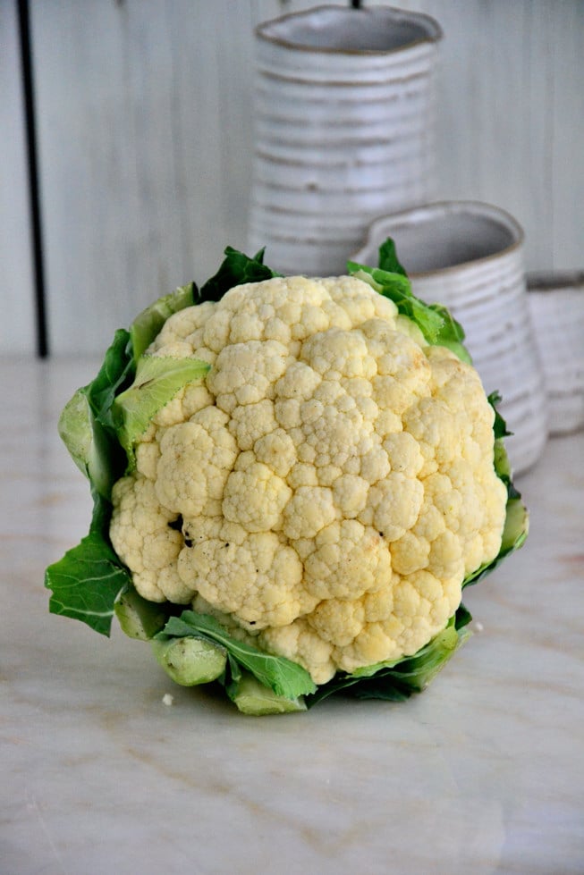 Fresh organic cauliflower read to be roasted in the oven.