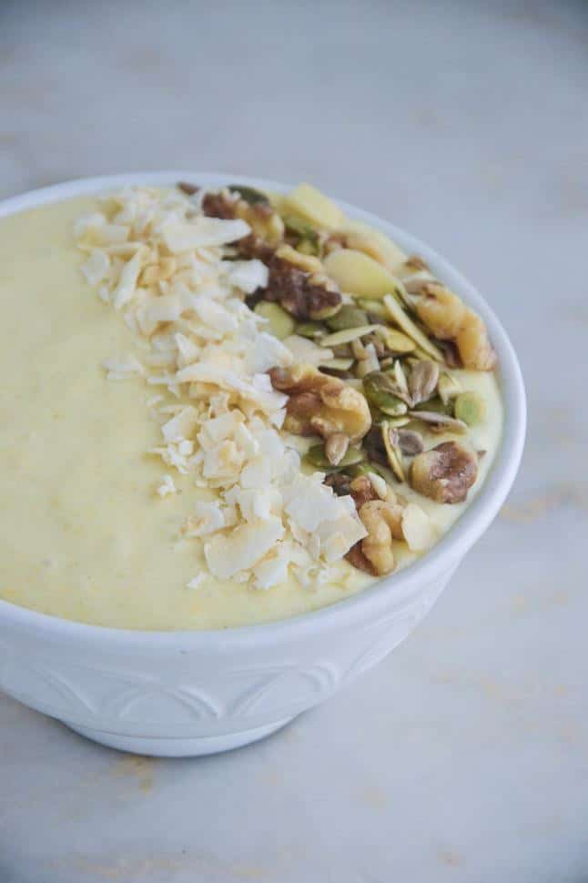 Mango Tango Smoothie bowl with coconut and nuts and seeds.